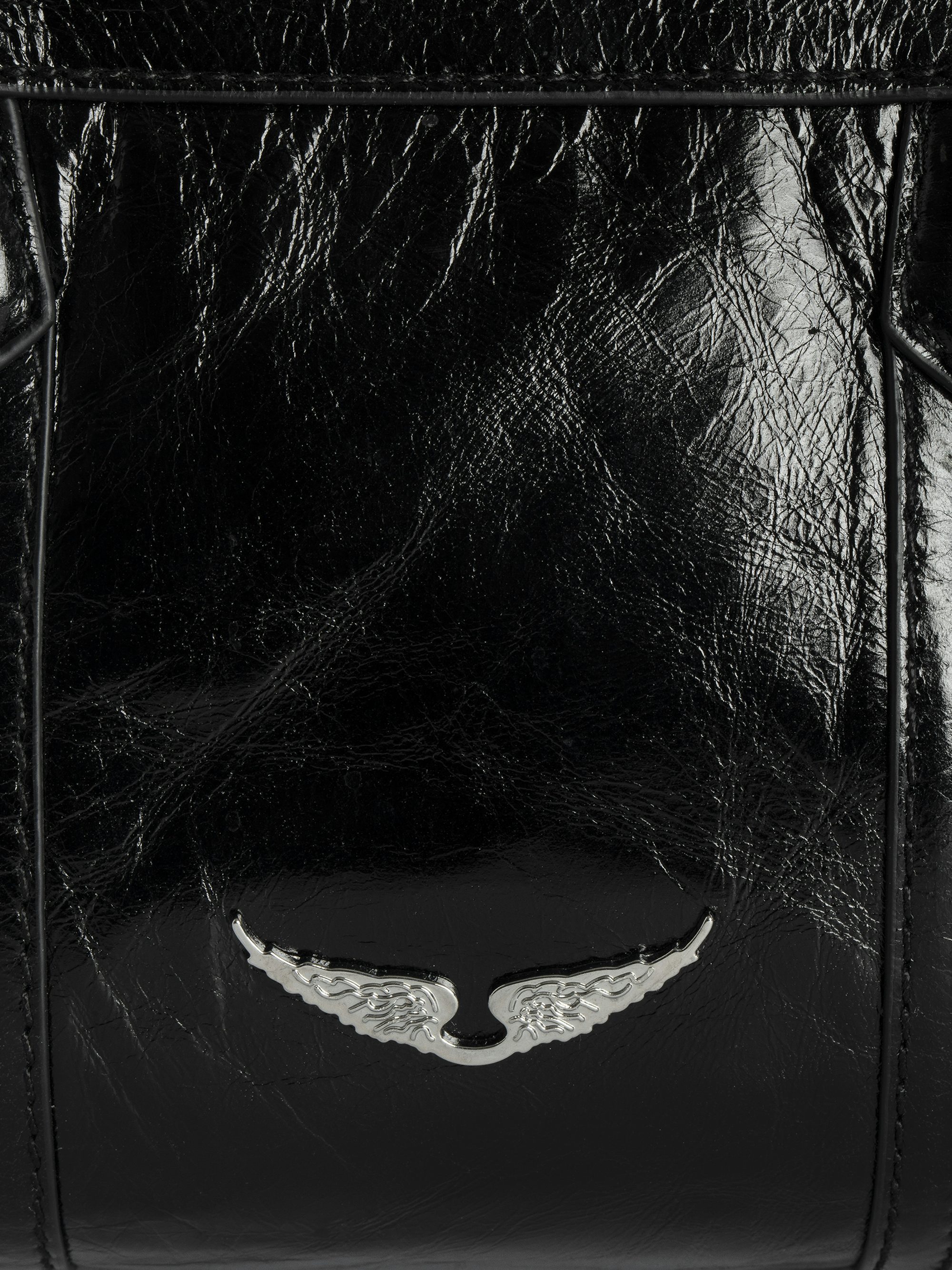 Sunny Mood Vintage Patent Bag - Patent leather bag with vintage effect, medallion charm and wing signatures.